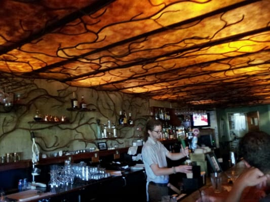 Photo of Roots Restaurant & Cellar - Milwaukee, WI, US. The Roots Cellar bar has wonderful, art nouveau organic metalwork on ceiling, walls and stairways.