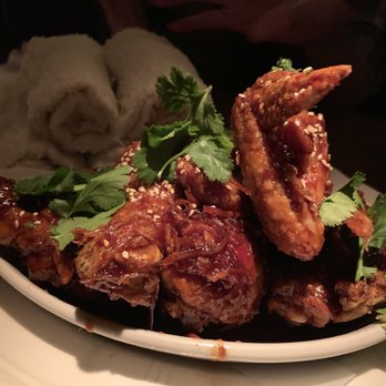 Au Cheval - Chicken appetizer. Great presentation with hot wet towels to clean your hands. - Bars Near Me - Chicago, Illinois