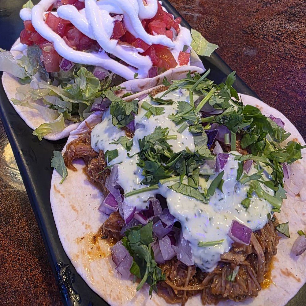 Bandoleros Tacos - Veggie on left, Carnitas on right, on flour tortillas. - Tacos Near Me - Sunrise, Florida Bandoleros Tacos - Veggie on left, Carnitas on right, on flour tortillas. - Tacos Near Me - Sunrise, Florida