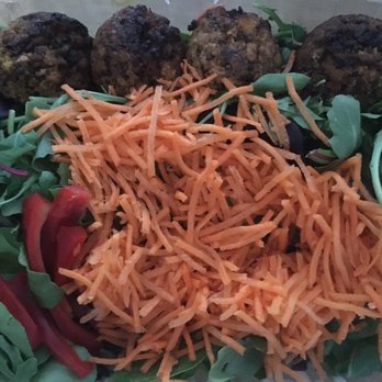 Cocobeet - Boston - Quinoa Burger on Arugula with Spicy Almond Spread - Juice Bars & Smoothies Near Me - Boston, Massachusetts