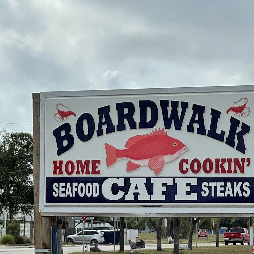 a sign for boardwalk seafood cafe steaks a sign for boardwalk seafood cafe steaks