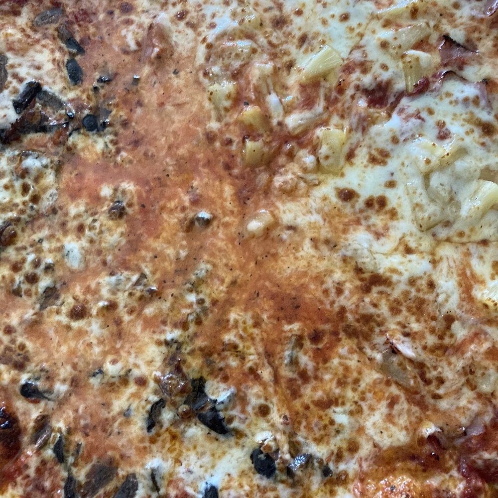 Barro's Pizza - A grease pot in the center of the pizza. - Pizza Near Me - Phoenix, Arizona Barro's Pizza - A grease pot in the center of the pizza. - Pizza Near Me - Phoenix, Arizona