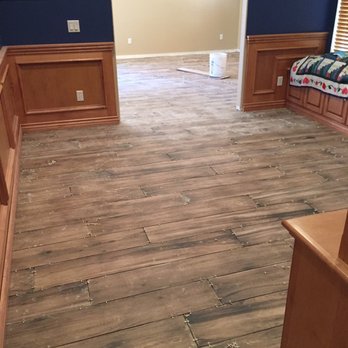 Castillo Carpet Shack - This picture was taken during installation. Tile is down, you can see spacers, and there is no grout yet. - Carpeting Near Me - Riverside, California