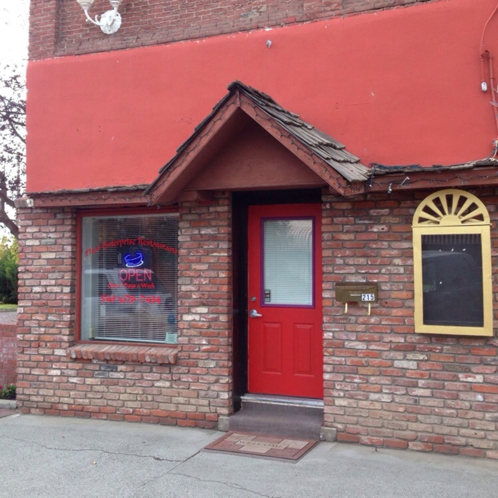 a red door and brick building