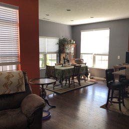 Our dining room in Moonlight Orchid against a Knockout Orange wall in our living room.