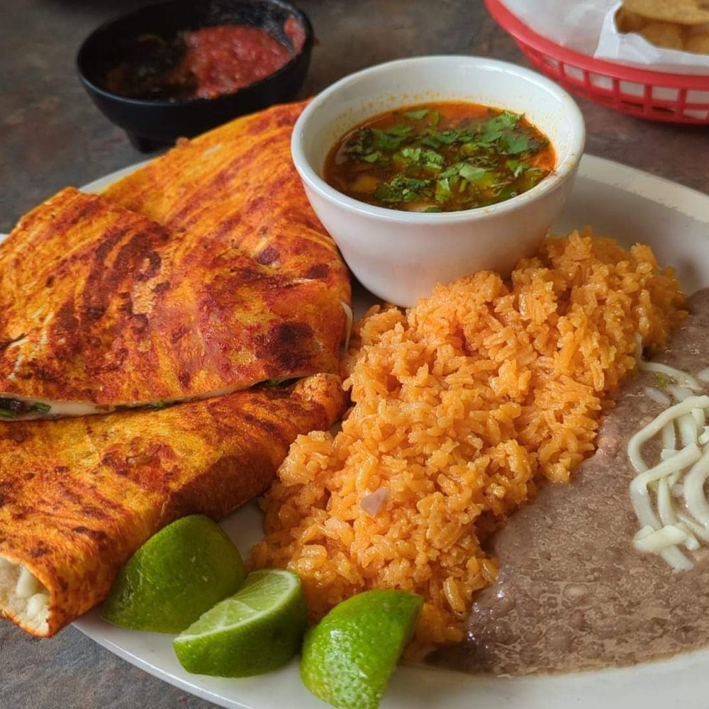 La Fajita - Not your everyday Quesadilla!!! Consume for dipping complemented the meal perfectly - Mexican Near Me - Lansing, Michigan La Fajita - Not your everyday Quesadilla!!! Consume for dipping complemented the meal perfectly - Mexican Near Me - Lansing, Michigan