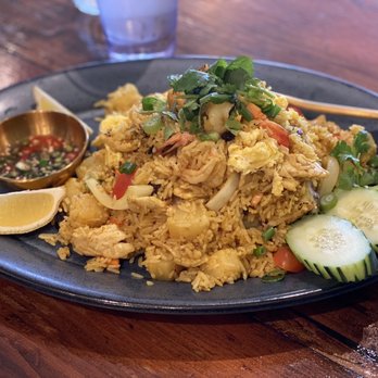 Golden Spoon - Pineapple fried rice, so delicious. Full of flavor and the little chili sauce to the side for the perfect kick. - Thai Near Me - Manteca, California