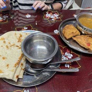 Indian Village Eatery - Naan, curry and samosas. Shared between two people. - Indian Near Me - Vancouver, British Columbia Indian Village Eatery - Naan, curry and samosas. Shared between two people. - Indian Near Me - Vancouver, British Columbia