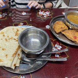 Indian Village Eatery - Naan, curry and samosas. Shared between two people.