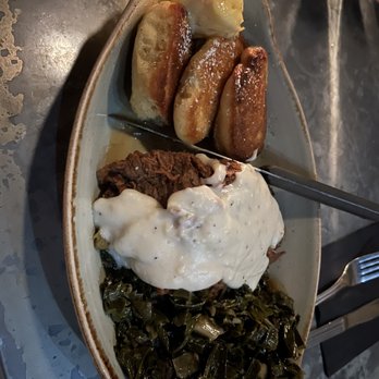 The Ice Plant - Pan-seared fried chicken with bacon collards and hoecakes. So good. - Cocktail Bars Near Me - St. Augustine, Florida