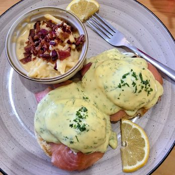 Comfort Cafe - Sammy Benny... a twist on Eggs Benedict. This is smoked salmon on the Eggs Benedict and a side of cheesy potatoes topped with bacon bits. - Breakfast & Brunch Near Me - San Antonio, Texas