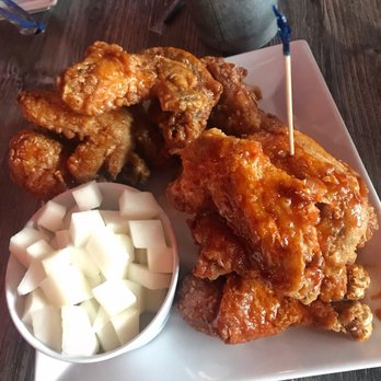 Bonchon - Korean fried chicken with pickled radish on the side - Chicken Wings Near Me - Orlando, Florida Bonchon - Korean fried chicken with pickled radish on the side - Chicken Wings Near Me - Orlando, Florida