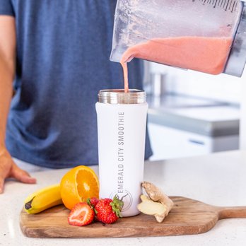 Emerald City Smoothie - a man pouring a smoothie into a blender - Juice Bars & Smoothies Near Me - Lakewood, Washington Emerald City Smoothie - a man pouring a smoothie into a blender - Juice Bars & Smoothies Near Me - Lakewood, Washington