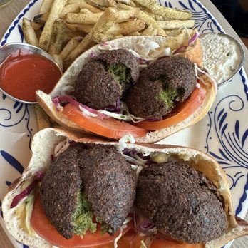 Ema - Green Falafel Sandwhich with side of za'atar fries - Mediterranean Near Me - Glenview, Illinois Ema - Green Falafel Sandwhich with side of za'atar fries - Mediterranean Near Me - Glenview, Illinois