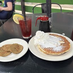 Banana pancakes (short stack), seitan sausage, and blood orange hibiscus iced tea