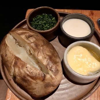 White Buffalo Club - BAKED IDAHO POTATO With Whipped butter / Crème Fraiche / Chives - Hotels Near Me - Jackson, Wyoming White Buffalo Club - BAKED IDAHO POTATO With Whipped butter / Crème Fraiche / Chives - Hotels Near Me - Jackson, Wyoming
