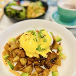 Burnt Orange - Avocado Chorizo Hash 20.50 Onion, Crispy Parmesan Crispy Potatoes, Sautéed Mushroom, 2 Poached Eggs, Champagne Hollandaise, Micoro Green