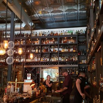 Canon - The bar and whiskey collection. - New American Near Me - Seattle, Washington