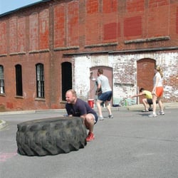 PE Fitness Studio - Flipping tires during bootcamp!