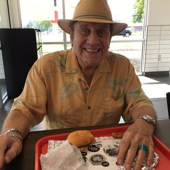 Halo Burger - hubby enjoying his burger..... - Burgers Near Me - Clinton Township, Michigan Halo Burger - hubby enjoying his burger..... - Burgers Near Me - Clinton Township, Michigan