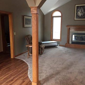All - Timate Flooring - a living room with a fireplace - Flooring Near Me - Green Bay, Wisconsin All - Timate Flooring - a living room with a fireplace - Flooring Near Me - Green Bay, Wisconsin