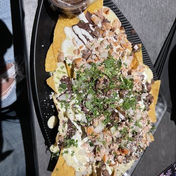Mic Drop Comedy - Nachos with steak and chicken extra queso. Ok. Fried are better. Food menu needs a revamp. - Comedy Clubs Near Me - San Diego, California