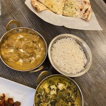 Aama's  Kitchen - Top: Garlic Cilantro Naan Left: Chicken Korma Right: Palak Paneer - Himalayan/Nepalese Near Me - Hayward, California
