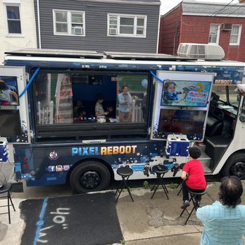 Pixel Reboot - Outside my house in Jersey City- I loved the personal happy messages on the tvs - Game Truck Rental Near Me - Jersey City, New Jersey