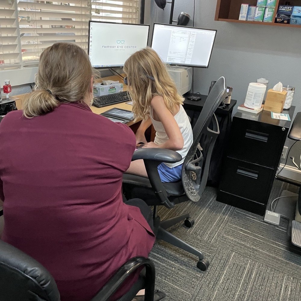 Fairway Eye Center - Dr. Nichols assessing Piper for eye therapy. - Optometrists Near Me - Fairway, Kansas Fairway Eye Center - Dr. Nichols assessing Piper for eye therapy. - Optometrists Near Me - Fairway, Kansas