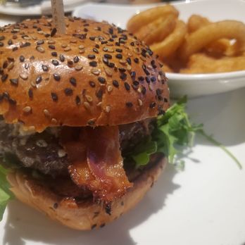 Yard House - Bleu cheese and bacon burger with onion rings - New American Near Me - Rancho Mirage, California Yard House - Bleu cheese and bacon burger with onion rings - New American Near Me - Rancho Mirage, California