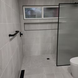 LJG Builders - Bathroom renovation with curb less shower floor. Extra wide custom niche.