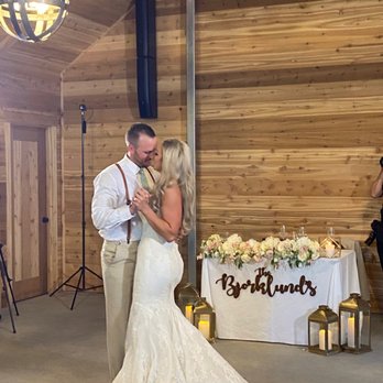 A Paper Flower Wedding - Sarah set up all flowers and lanterns for our sweetheart table and hung our sign perfectly! - Wedding Planning Near Me