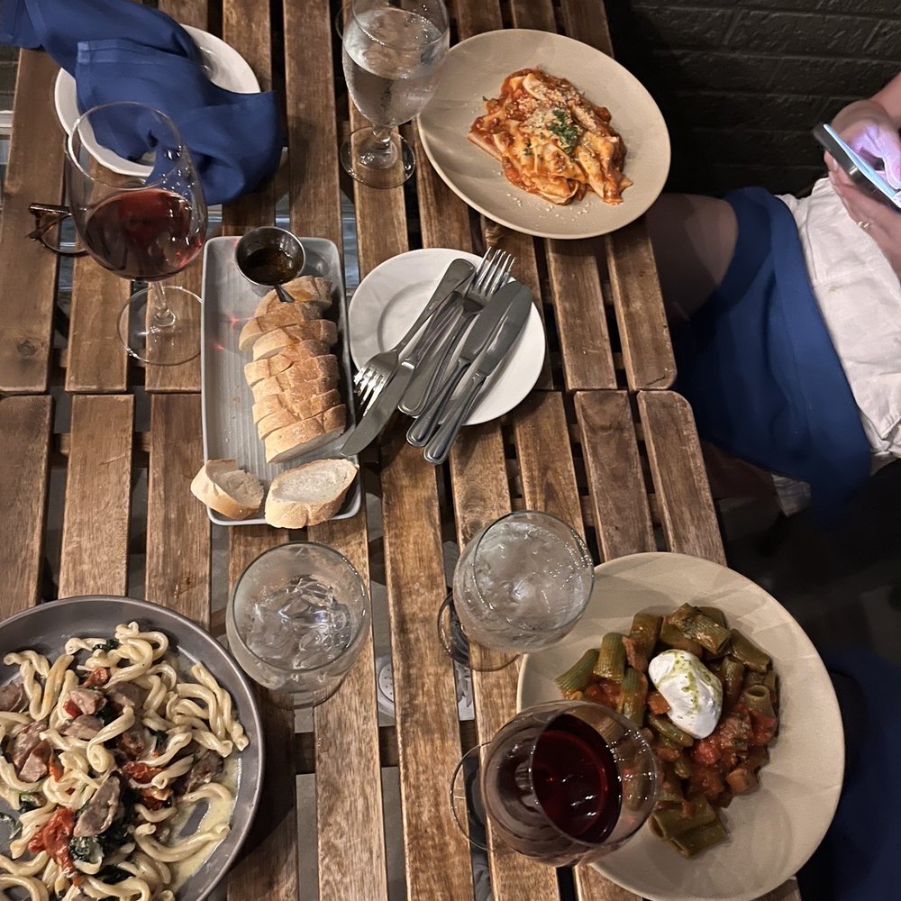 Burrata - a wooden table with plates of food on it - Italian Near Me - Philadelphia, Pennsylvania Burrata - a wooden table with plates of food on it - Italian Near Me - Philadelphia, Pennsylvania