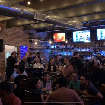 Rooftop Lounge - a large group of people at a bar - Lounges Near Me - Laredo, Texas