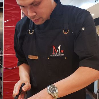 M Sushi Bistro - Chef Minh in action with the uni from Japan. - Sushi Bars Near Me - Lodi, California M Sushi Bistro - Chef Minh in action with the uni from Japan. - Sushi Bars Near Me - Lodi, California