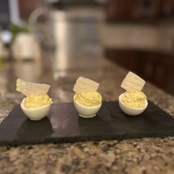 Dakota’s Gourmet at Home - Truffle devilled eggs topped with padano cheese