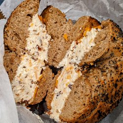Bagel Pub - May 6 2022; Whole wheat everything bagel w. bacon cheddar cream cheese ($5.38).