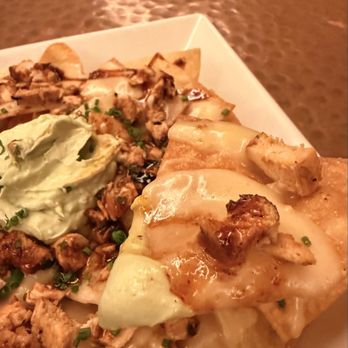 Outwest - Close up of the Grilled Chicken Nachos - Steakhouses Near Me - Kernersville, North Carolina Outwest - Close up of the Grilled Chicken Nachos - Steakhouses Near Me - Kernersville, North Carolina