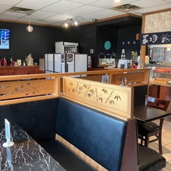 Sushi Karis - Our venue for lunch yesterday - decently prepared sushi. View from table, service counter, tables, etc.
