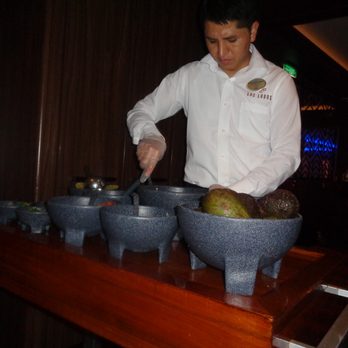 Norwegian Cruise Line - Preparing Guac Tableside at Los Lobos - Travel Services Near Me - Downtown Miami, Florida