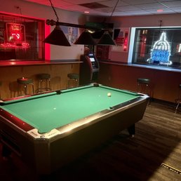 a pool table in the foreground