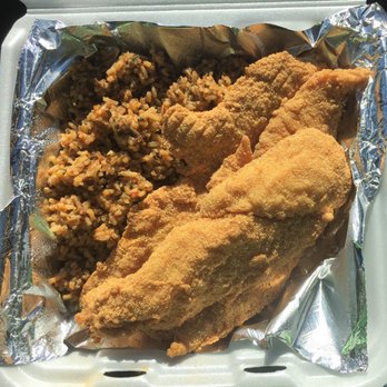 Lockhart Steak And Seafood - Three pieces of large catfish with Cajun rice - Seafood Near Me - Lockhart, Texas Lockhart Steak And Seafood - Three pieces of large catfish with Cajun rice - Seafood Near Me - Lockhart, Texas