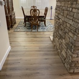 a dining room with a table and chairs