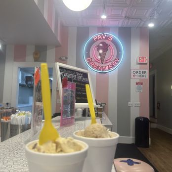 Pav’s Creamery - Death by peanut butter and pumpkin pecan pie in front of the inside restaurant logo - Ice Cream & Frozen Yogurt Near Me - Cuyahoga Falls, Ohio Pav’s Creamery - Death by peanut butter and pumpkin pecan pie in front of the inside restaurant logo - Ice Cream & Frozen Yogurt Near Me - Cuyahoga Falls, Ohio