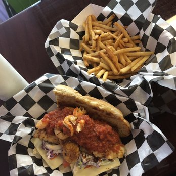 Mud Bugs - Gulf red fish po boy......lemon garlic fries Really awesome, amazing food. - Cajun/Creole Near Me - Kansas City, Missouri Mud Bugs - Gulf red fish po boy......lemon garlic fries Really awesome, amazing food. - Cajun/Creole Near Me - Kansas City, Missouri