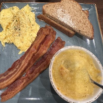 First Watch - Two egg breakfast with cheese grits, crispy pork bacon, and wheat toast. - Breakfast & Brunch Near Me - Winston-Salem, North Carolina