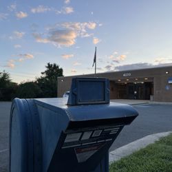 US Post Office - Blue box at sunset