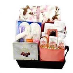 Corporate Gift Solutions - A fabulous women's spa gift set which includes a plush quality robe, a pedicure gift set, a box of gourmet chocolate and Bath & Spa Products