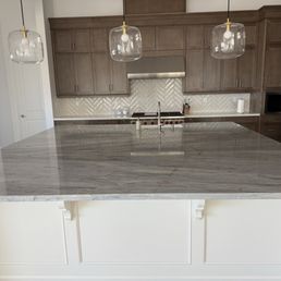 Kitchen island cabinets painted white.