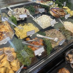 Assorted salads/side dishes/grilled salmon (upper right)